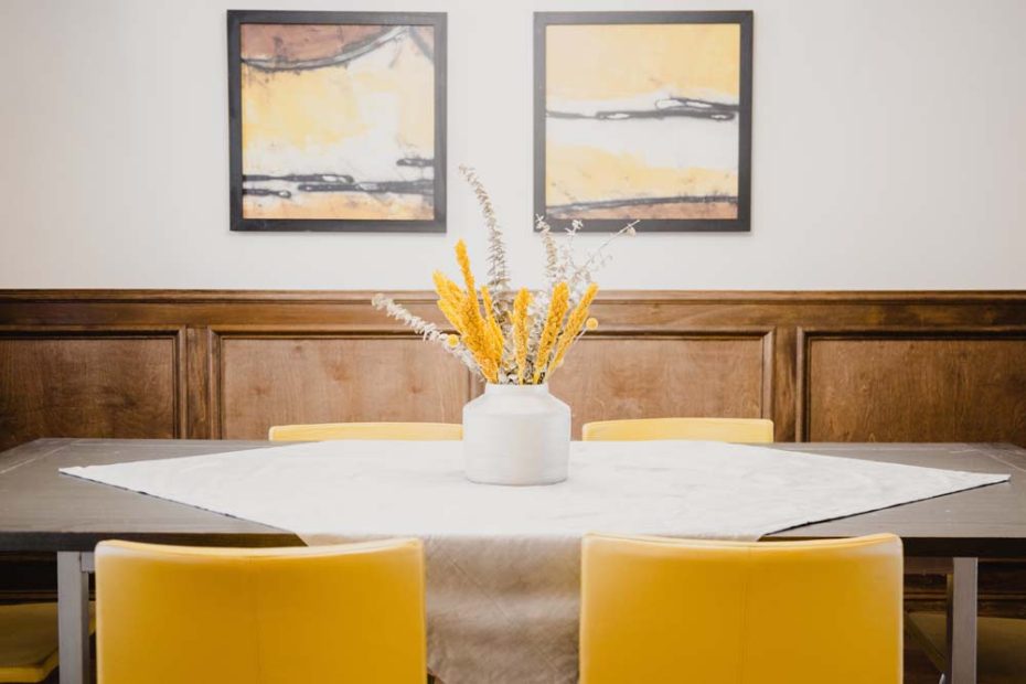 dining room with warm wall arts