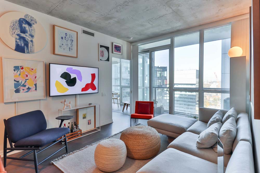 a living room interior with abstract arts